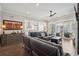 The open living room features a leather sofa, stylish furnishings, and an open view to the kitchen at 184 Clearblue Loop, Summerville, SC 29486