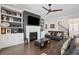 Living room features a ceiling fan, fireplace, built-in shelving, and an open floor plan at 184 Clearblue Loop, Summerville, SC 29486