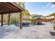 An outdoor oasis awaits with this home's pool, water feature, outdoor kitchen, and multiple seating areas for entertaining at 184 Clearblue Loop, Summerville, SC 29486