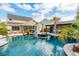 This property boasts a stunning backyard pool featuring a circular water feature and multiple areas for outdoor entertaining at 184 Clearblue Loop, Summerville, SC 29486