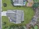 Aerial view showcases a well-maintained roof and expansive lawn on a home with lush surrounding greenery at 2004 Hammond Dr, Mount Pleasant, SC 29466