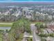 Scenic aerial view highlighting a residential neighborhood surrounded by a dense forest and a serene lake at 2004 Hammond Dr, Mount Pleasant, SC 29466