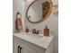 Stylish bathroom vanity featuring a wooden framed mirror, soap dispenser, and floral decoration at 2004 Hammond Dr, Mount Pleasant, SC 29466