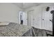 Bright bedroom with grey wood-look flooring and multiple doors offers versatility and modern charm at 2004 Hammond Dr, Mount Pleasant, SC 29466