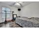 Cozy bedroom features ceiling fan and natural light, creating a comfortable retreat for relaxation at 2004 Hammond Dr, Mount Pleasant, SC 29466