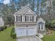 Charming two-story home featuring a two-car garage, front garden, and landscaped yard at 2004 Hammond Dr, Mount Pleasant, SC 29466