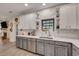 Updated kitchen features marble countertops, stainless steel appliances, and white subway tile backsplash at 2004 Hammond Dr, Mount Pleasant, SC 29466