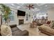 Spacious living room has a fireplace, large windows, and views of the open concept kitchen and dining space at 2004 Hammond Dr, Mount Pleasant, SC 29466