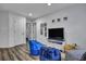 Spacious living room featuring blue bean bags, TV, white walls, and luxury vinyl plank flooring at 2004 Hammond Dr, Mount Pleasant, SC 29466