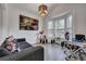 Cozy living room with bright windows, featuring modern decor, a comfortable couch, and an office area at 2004 Hammond Dr, Mount Pleasant, SC 29466