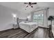 Cozy main bedroom featuring luxury vinyl plank flooring, large windows, and neutral paint at 2004 Hammond Dr, Mount Pleasant, SC 29466