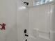 Clean shower enclosure with white tiled walls and a dark bronze shower fixture. Natural light from the window at 2004 Hammond Dr, Mount Pleasant, SC 29466
