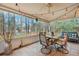 Inviting sunroom with tile flooring, a ceiling fan, and comfortable seating, perfect for relaxation and entertaining at 2004 Hammond Dr, Mount Pleasant, SC 29466
