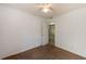 A bright, empty bedroom featuring a ceiling fan, carpet, and an open doorway at 203 Elliott Dr, Ladson, SC 29456
