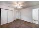 Bedroom featuring double closets, ceiling fan, and an ensuite bathroom, offering comfort and convenience at 203 Elliott Dr, Ladson, SC 29456
