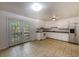 Open kitchen with white cabinets, a stainless steel refrigerator, and glass doors that lead to the backyard at 203 Elliott Dr, Ladson, SC 29456