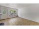 Bright living room with tile flooring, white walls, and a front door leading to the outside, capturing natural light at 203 Elliott Dr, Ladson, SC 29456