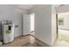 Utility room featuring a water heater, open doorway and tile floors at 203 Elliott Dr, Ladson, SC 29456