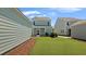 Beautiful backyard view showcasing green grass and tidy landscaping, creating a serene outdoor space at 211 Terrace View Dr, Summerville, SC 29486