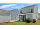 Charming backyard featuring a screened porch, lush green lawn, and well-maintained landscaping at 211 Terrace View Dr, Summerville, SC 29486