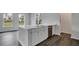 Charming kitchen with a white island, modern appliances, and sleek gray floors at 211 Terrace View Dr, Summerville, SC 29486