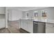 Bright kitchen features white cabinets, stainless steel appliances, and a large island with a sink at 211 Terrace View Dr, Summerville, SC 29486
