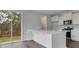 Open kitchen features a white island, stainless steel appliances, and access to the outdoors at 211 Terrace View Dr, Summerville, SC 29486