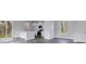 Bright living room with sliding glass door, hardwood floors, and white walls at 211 Terrace View Dr, Summerville, SC 29486