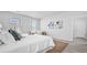 Bright bedroom with white bedding, soft textures, and natural light streaming through the windows at 213 Terrace View Dr, Summerville, SC 29486