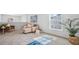 Bright bonus room with plush seating, a fitness area, and a view of neighborhood at 213 Terrace View Dr, Summerville, SC 29486