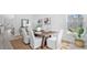 Bright dining room with wooden table, white chairs, stylish rug, and natural light at 213 Terrace View Dr, Summerville, SC 29486