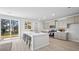 Modern kitchen with stainless steel appliances, large island, and sliding glass door to yard at 213 Terrace View Dr, Summerville, SC 29486