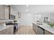 Spacious kitchen featuring stainless steel appliances, white counters, and open floorplan at 213 Terrace View Dr, Summerville, SC 29486