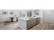 Open kitchen with white countertops, dining table, stainless steel appliances, and natural light at 213 Terrace View Dr, Summerville, SC 29486