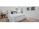 Cozy bedroom features a queen bed with blue pillows, windows with natural light, and neutral tones at 213 Terrace View Dr, Summerville, SC 29486
