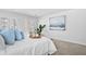 Bright main bedroom featuring white bedding, blue pillows, and french doors at 213 Terrace View Dr, Summerville, SC 29486