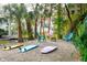 This backyard has a seating area, a fire pit, and surfboards on the ground at 217 E Huron Ave, Folly Beach, SC 29439