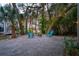 This home features an outdoor seating area with a fire pit and bench seating at 217 E Huron Ave, Folly Beach, SC 29439
