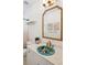 The bathroom features a vanity with a decorative sink, and a decorative mirror at 217 E Huron Ave, Folly Beach, SC 29439