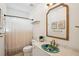 A stylish bathroom boasts an artistic sink, decorative mirror, and modern fixtures at 217 E Huron Ave, Folly Beach, SC 29439