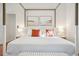 This bedroom features a cozy bed with plush pillows and modern decor at 217 E Huron Ave, Folly Beach, SC 29439
