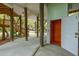 This home features an elevator, stairs, and ample parking and storage space beneath the raised house at 217 E Huron Ave, Folly Beach, SC 29439