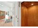 Interior shot featuring an elevator, hardwood floors, a wooden front door, and a glimpse into the open living space at 217 E Huron Ave, Folly Beach, SC 29439