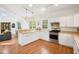 Well-lit kitchen with modern appliances, a breakfast bar, and an open layout to the living area, ideal for entertaining at 217 E Huron Ave, Folly Beach, SC 29439