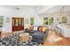 Bright and airy living area boasting high ceilings, an open floor plan, and stylish decor, perfect for modern living at 217 E Huron Ave, Folly Beach, SC 29439