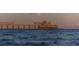 Picturesque view of a pier extending into the calm ocean waters at 217 E Huron Ave, Folly Beach, SC 29439