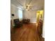 Comfortable living room featuring wood floors, ceiling fan, and fireplace at 227 & 229 Fishburne St, Charleston, SC 29403