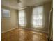 Bedroom with two big windows that allow ample natural light at 227 Fishburne St, Charleston, SC 29403