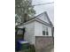 Single-story home with a brick foundation and white siding, featuring a chimney and a fenced yard at 227 Fishburne St, Charleston, SC 29403