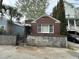 Charming brick home features a well-maintained facade with a concrete block foundation and awning over the front porch at 227/229/3 Fishburne/Woodall St, Charleston, SC 29403